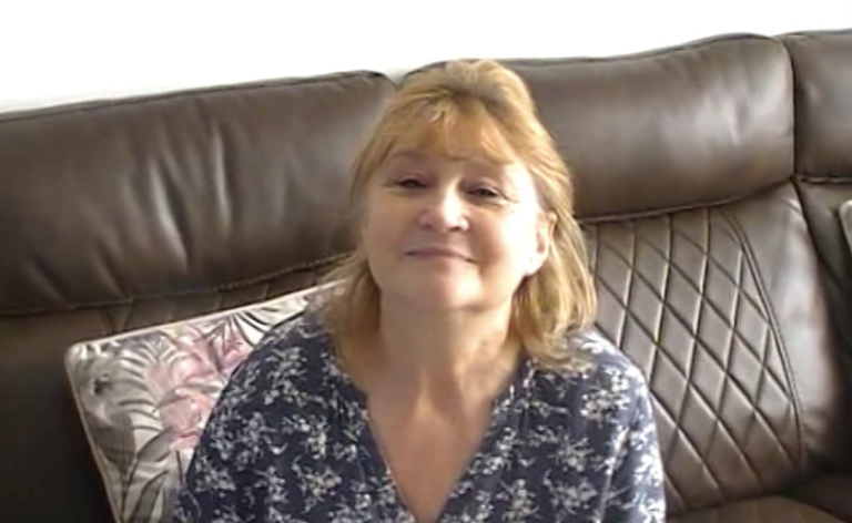 A resident's daughter providing reassurance and familiar messages to support her mother during periods of distress.